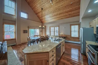a large kitchen with a table and a dining room at Buffalo Lodge 3 Bed 3 Bath BLCD3 in Keystone