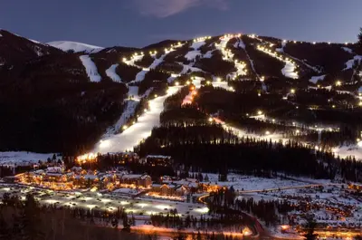 a ski resort with lights on a mountain at night at Buffalo Lodge 3 Bed 3 Bath BLCD3 in Keystone