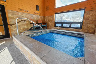 a large swimming pool in a room with a window at Tennis Townhome 2 Bd 25 Ba TTMR in Keystone
