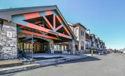 a building with a geometric facade on a street at Gateway Lodge 5099 by SummitCove Lodging in Keystone