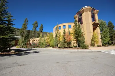 an empty parking lot in front of a building at Antlers Gulch 501 by SummitCove Lodging in Keystone