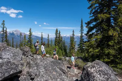 a group of people standing on top of some rocks at Alders 854 By SummitCove Lodging in Keystone