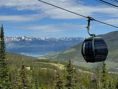 a gondola ride in a ski lift in the mountains at Alders 854 By SummitCove Lodging in Keystone