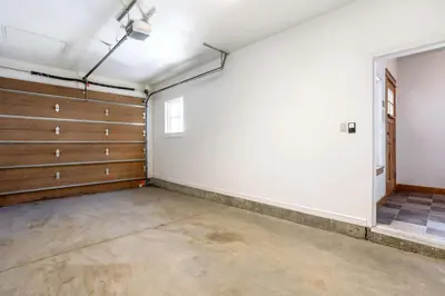 an empty garage with wooden doors and a window at Seasons 1850 in Keystone