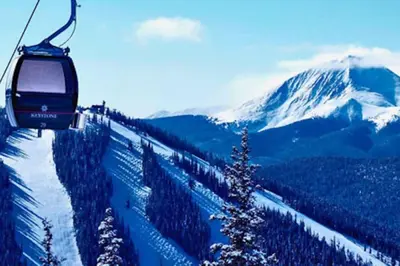 a ski lift going up a snow covered mountain at Seasons 1850 in Keystone