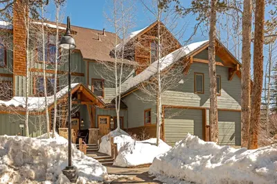 a house in the snow with snow piled up at Seasons 1850 in Keystone