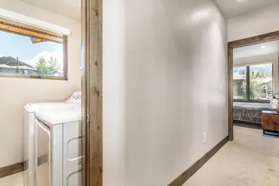 a bathroom with a sink and a mirror at Treehouse Village 323 in Silverthorne
