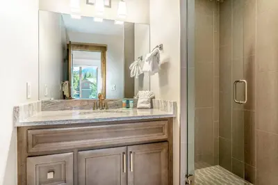 a bathroom with a sink and a shower at Treehouse Village 323 in Silverthorne