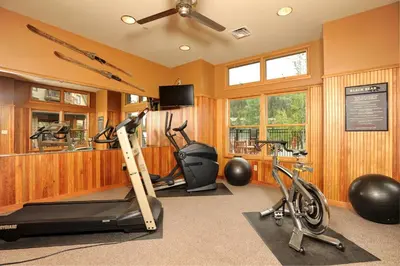 a gym with exercise equipment and two exercise bikes at Spacious 1Br Condo-River Run Village-Hot Tub & Kids Ski Free Condo in Keystone