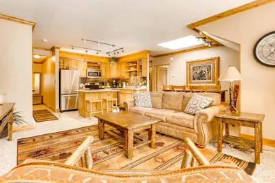 a living room with a couch and a table at Spacious 1Br Condo-River Run Village-Hot Tub & Kids Ski Free Condo in Keystone