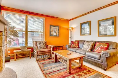 a living room with a couch and a table at Updated 1Br Premier Condo At Black Bear Lodge- Kids Ski Free Condo in Keystone