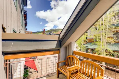 a balcony with two benches and a large window at Updated 1Br Premier Condo At Black Bear Lodge- Kids Ski Free Condo in Keystone