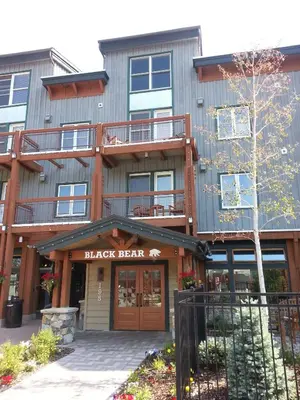 a large building with a black bear sign on it at Updated 1Br Premier Condo At Black Bear Lodge- Kids Ski Free Condo in Keystone