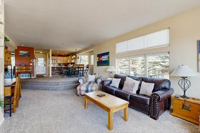a living room with a couch and a table at Bay Club 107 in Frisco