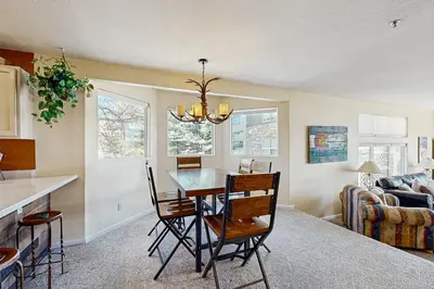 a kitchen and dining room with a table and chairs at Bay Club 107 in Frisco