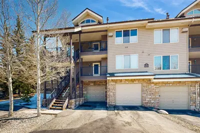 a house with two garage doors in front of it at Bay Club 107 in Frisco