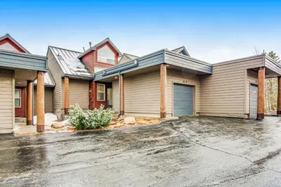a house with a driveway in front of it at Forest Park 31E in Silverthorne
