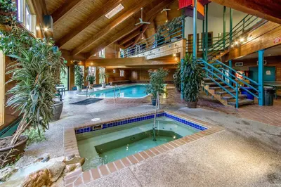 an indoor pool in a building with a house at Buffalo Ridge Retreat in Silverthorne