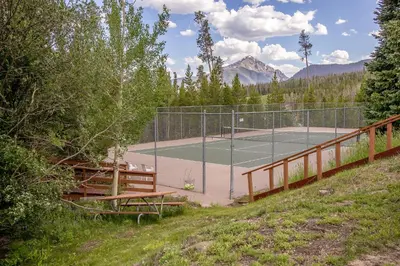 a tennis court with a tennis court at Buffalo Ridge Retreat in Silverthorne