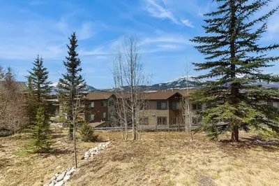 a large building with trees in front of it at Lookout Ridge 63 in Dillon