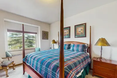 a bedroom with a bed and a window at Lookout Ridge 63 in Dillon