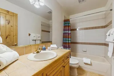 a bathroom with a sink and a tub and a toilet at Lookout Ridge 63 in Dillon