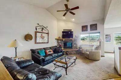 a living room with a couch and a fireplace at Lookout Ridge 63 in Dillon