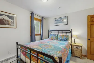 a bedroom with a bed and a window at Ore House 8 in Frisco