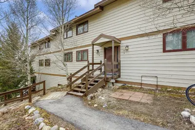 a house with a wooden staircase leading to the door at Ore House 8 in Frisco