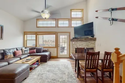 a living room with a couch and a table at La Riva Del Lago 209 in Dillon