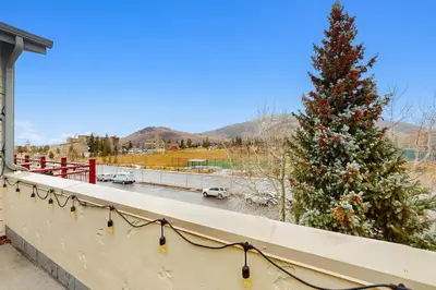 a christmas tree on the balcony of a house at La Riva Del Lago 209 in Dillon