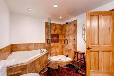 a large bathroom with a tub and a shower at Premier 4 Bedroom Ski In, Ski Out Vacation Rental At The Timbers With The Best Access To Skiing In Keystone in Keystone