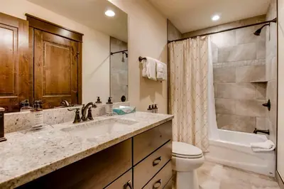 a bathroom with a sink and a toilet and a shower at Spacious 3 Bedroom Townhome In River Run Village Within Walking Distance To Gondola And Restaurants in Keystone
