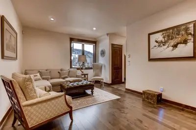 a living room with a couch and a table at Spacious 3 Bedroom Townhome In River Run Village Within Walking Distance To Gondola And Restaurants in Keystone