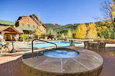 a hot tub in the middle of a patio at 1 Bedroom Plus Murphy Mountain Condo In River Run Village With Mountain Views And Walking Distance To Ski Slopes in Keystone