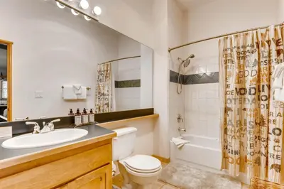 a bathroom with a sink and a toilet and a tub at 1 Bedroom Plus Murphy Mountain Condo In River Run Village With Mountain Views And Walking Distance To Ski Slopes in Keystone