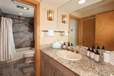 a bathroom with a sink and a toilet at Ski In 2 Bedroom At Chateaux Dumont Keystone in Keystone