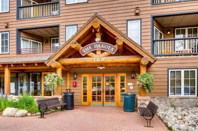 a building with a sign that reads first dance at 3 Bedroom Mountain Condo In River Run Village With Expansive Mountain Views And Walking Distance To Ski Slopes in Keystone