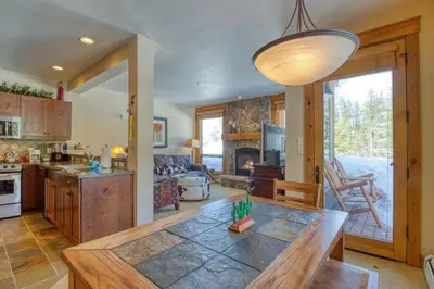 a kitchen and living room with a table in a room at Private Family Friendly 2 Bedroom Townhome Located In East Keystone With Access To Free Shuttle Service in Keystone