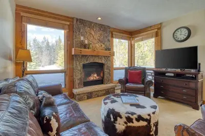a living room with a couch and a fireplace at Private Family Friendly 2 Bedroom Townhome Located In East Keystone With Access To Free Shuttle Service in Keystone