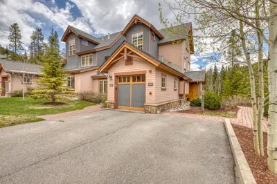 a large house with a driveway in front of it at Private Family Friendly 2 Bedroom Townhome Located In East Keystone With Access To Free Shuttle Service in Keystone