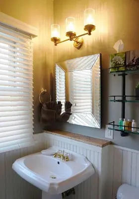 a bathroom with a sink and a mirror at Edwards House in Fort Collins