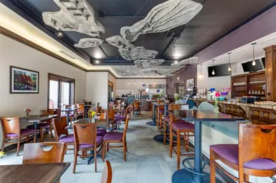 a dining room with tables and chairs and tablesktop at Best Western Denver Southwest in Lakewood