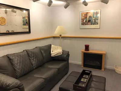 a living room with a couch and a fireplace at On the Divide in Bailey