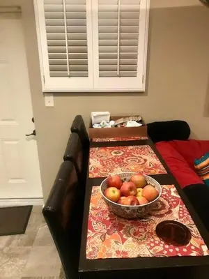 a table with a bowl of fruit on a couch at Denver Blue Bear Den 3BR 2BA & Spa in Denver