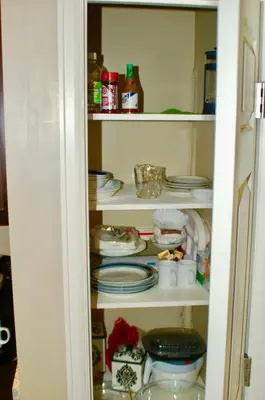 a pantry with plates and dishes in it at Denver Blue Bear Den 3BR 2BA & Spa in Denver