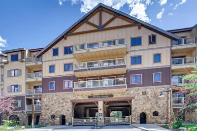 an exterior view of a large apartment building with balconies at Premier Red Hawk Lodge 2 Br-Walk To Slopes-Kids Ski Free Condo in Keystone