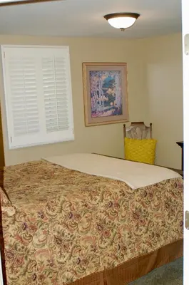a large bed in a bedroom with a window at Blue Bear Den 3BR 2BA DTC Private Apt Hot Tub in Denver