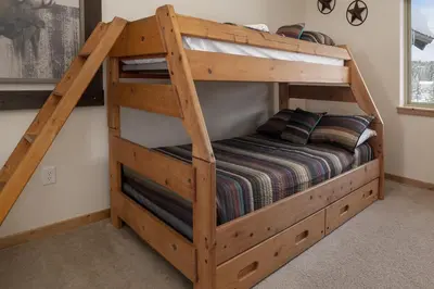 a bunk bed in the corner of a room at Trailhead Lodge 734 Condo in Winter Park