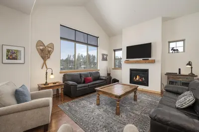a living room with a couch and a fireplace at Trailhead Lodge 734 Condo in Winter Park